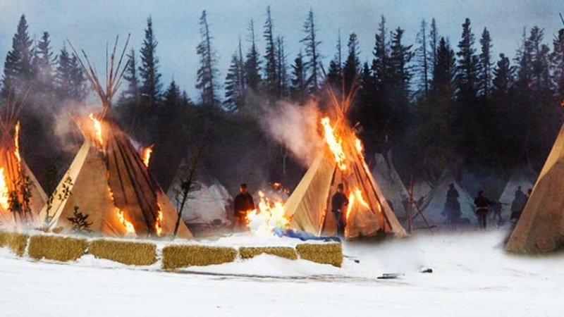 Fake photo supposedly depicting the burning of tipis at the NoDAPL protests in North Dakota, which is actually a publicity photo for the 2007 HBO TV movie Bury My Heart at Wounded Knee